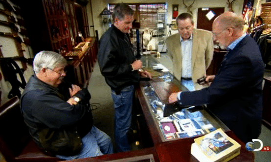 R.L. Wilson and Steve Fjestad examining the firearms.